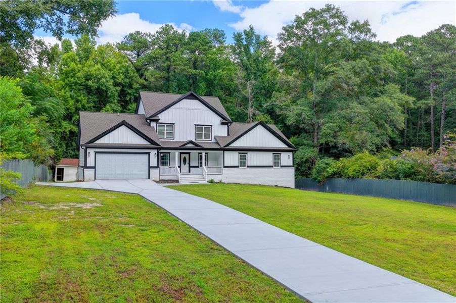 Front exterior of a new home in , Snellville, GA, highlighting curb appeal (Image 2). Front exterior of a new home in , Snellville, GA, highlighting curb appeal (Image 2).