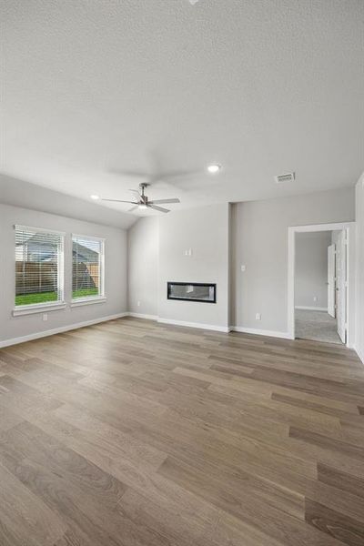 Living Room in the Emmy II home plan by Trophy Signature Homes - REPRESENTATIVE PHOTO