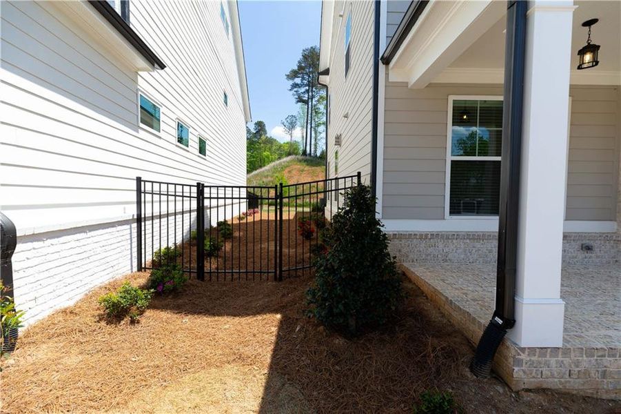 Exterior details and patio area of a home in Waterside Single Family, Peachtree Corners (Image 26).