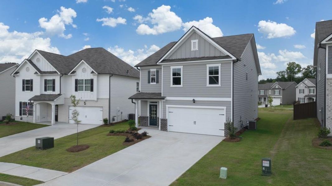 Front exterior of a new home in Lost Creek, Dallas, GA, highlighting curb appeal (Image 2). Front exterior of a new home in Lost Creek, Dallas, GA, highlighting curb appeal (Image 2).