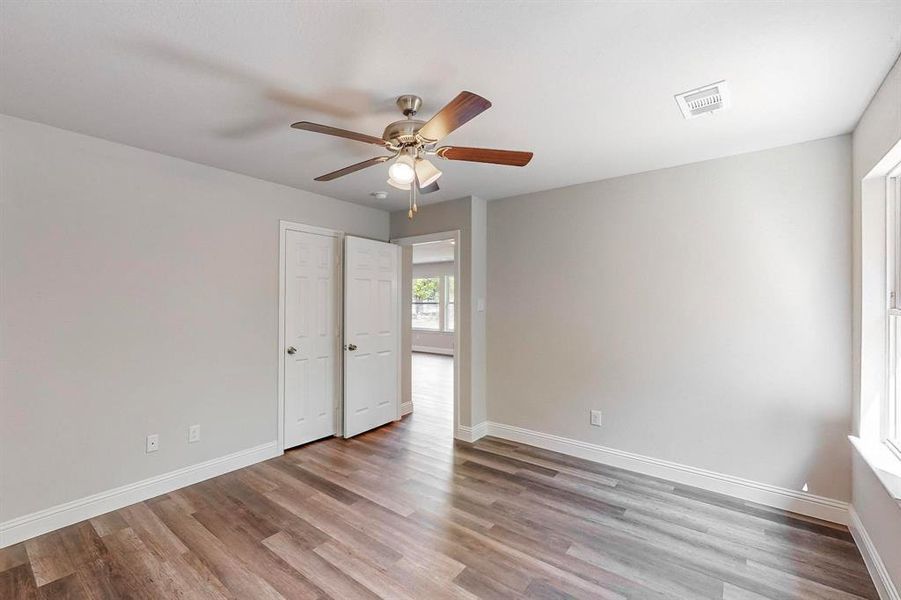 Spare room with ceiling fan and light hardwood / wood-style flooring