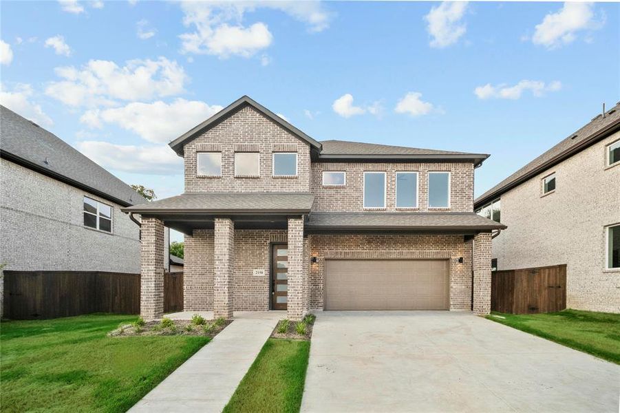 View of front facade featuring a garage, brick siding, concrete driveway, and a shingled roof