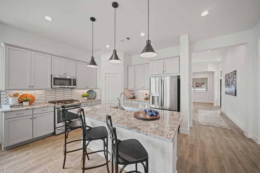 Representative furnished interior of a home built from the Athens by Chesmar Homes in Sunterra, Katy (Image 8).