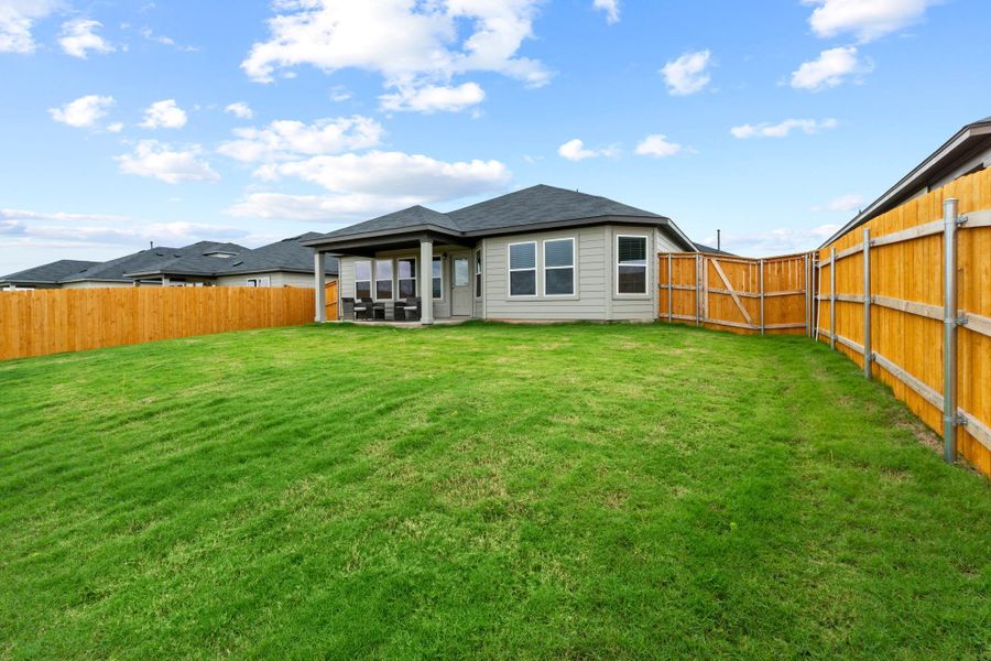 There is plenty of room to set up a yard game, start a small garden, or just relax in the afternoon sun There is plenty of room to set up a yard game, start a small garden, or just relax in the afternoon sun