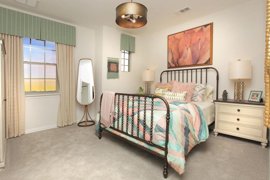 Guest bedroom with pink and green linens Guest bedroom with pink and green linens