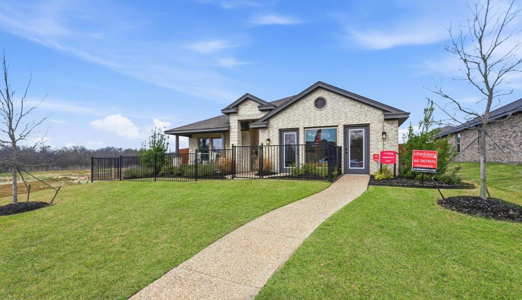 Front exterior of a new home in Trail Creek, Cleburne, TX, highlighting curb appeal (Image 10).