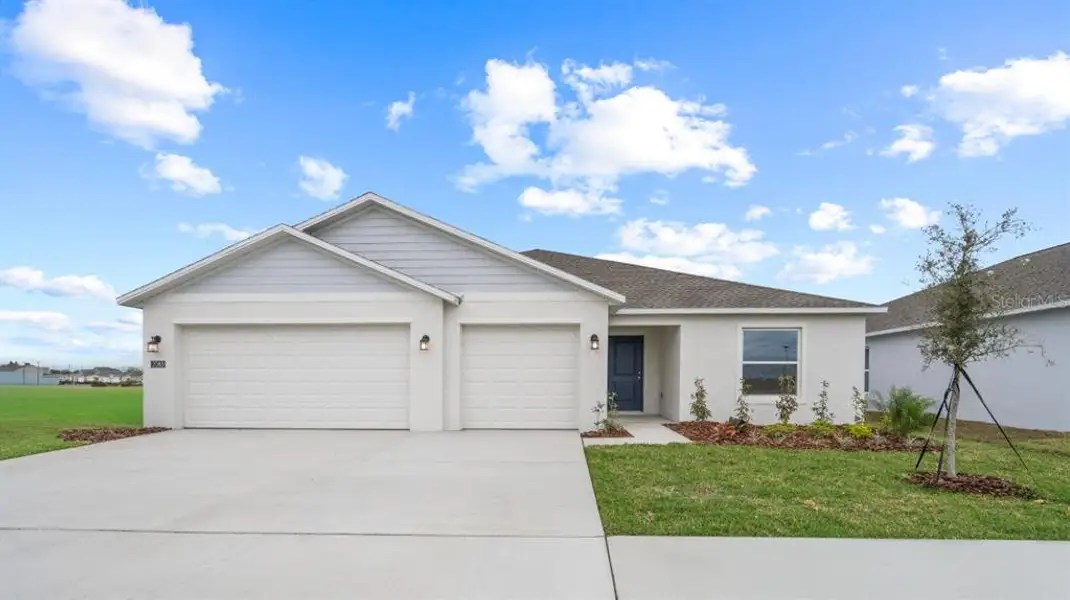 Front exterior of a new home in , Eagle Lake, FL, highlighting curb appeal (Image 1). Front exterior of a new home in , Eagle Lake, FL, highlighting curb appeal (Image 1).