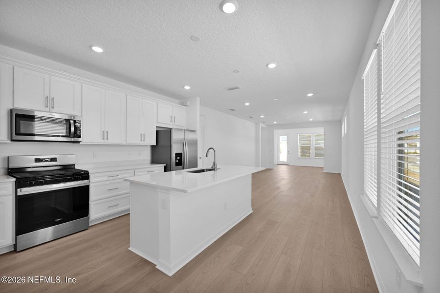 Furnished interior view inside a new home in Del Webb Wildlight, Yulee (Image 6).