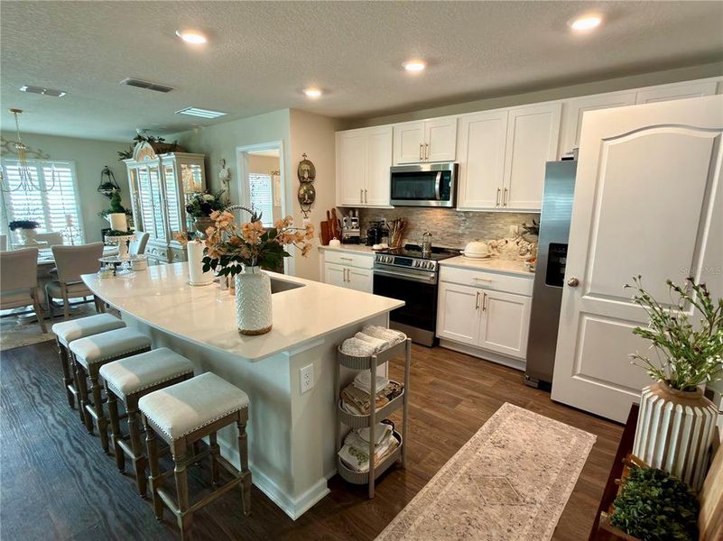 Furnished interior view inside a new home in Sawmill Branch Express, Palm Coast (Image 9).