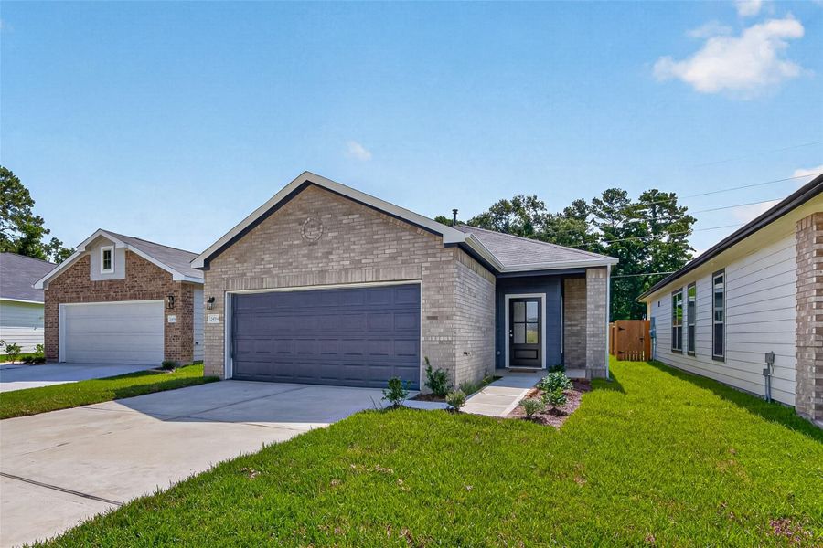 Front exterior of a new home in Woodland Lakes, Huffman, TX, highlighting curb appeal (Image 1). Front exterior of a new home in Woodland Lakes, Huffman, TX, highlighting curb appeal (Image 1).