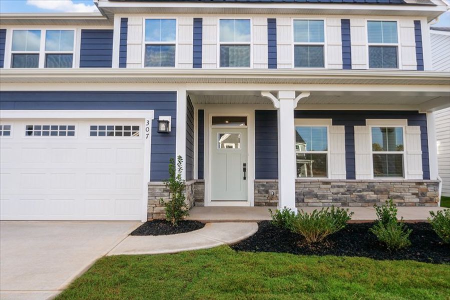 Exterior details and patio area of a home in Canterbrook Farms 2-Story, Fountain Inn (Image 2).