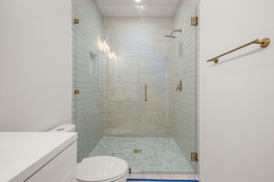 Bathroom featuring vanity and a stall shower