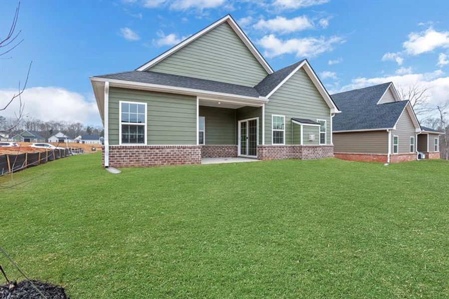Exterior details and patio area of a home in Newberry 55+, McDonough (Image 3).