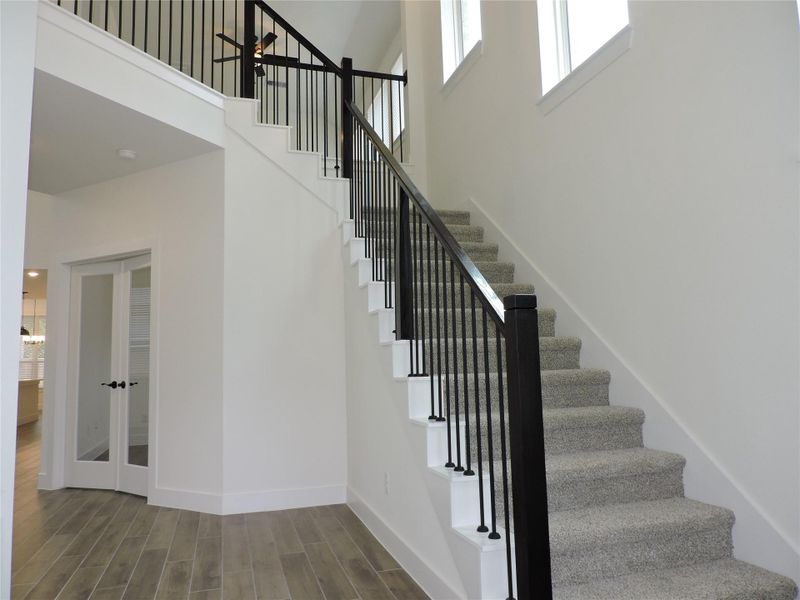 Lets look around the first floor, Ahead on the right, the French doors open to the Home Office or 5th bedroom with large walk in closet.