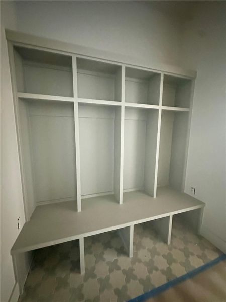 Mudroom featuring carpet Mudroom featuring carpet