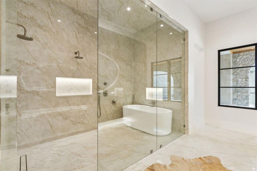 Spacious Bath oasis with designer mirrors and lighting, built-in cabinetry, lighting under cabinetry, duel shower, Hollywood soaking tub, and tile floors Spacious Bath oasis with designer mirrors and lighting, built-in cabinetry, lighting under cabinetry, duel shower, Hollywood soaking tub, and tile floors