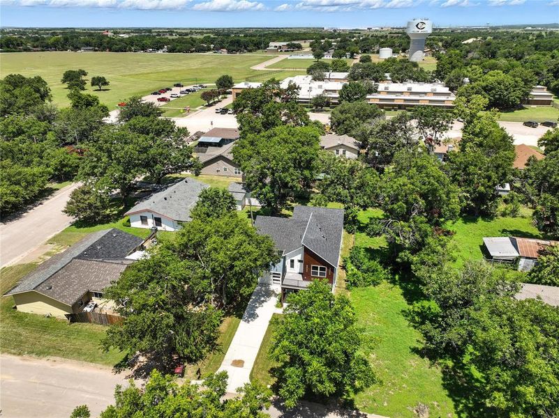 Aerial view of residential area with a tree filled landscape
