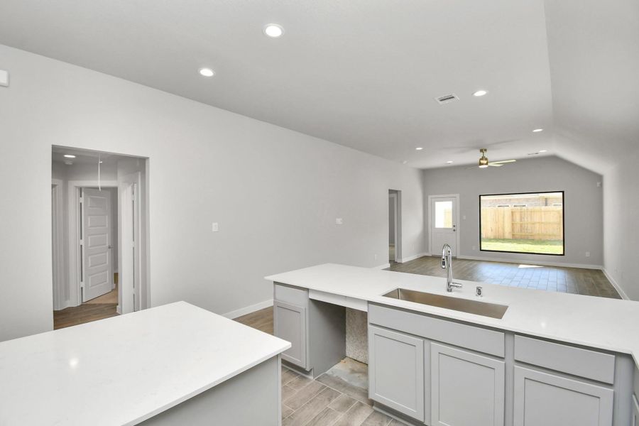 All of this overlooks your expansive family room, creating a perfect space for culinary delights and family gatherings.