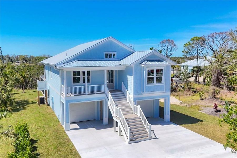 Front exterior of a new home in , Englewood, FL, highlighting curb appeal (Image 25).