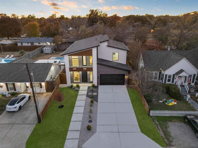 Front exterior of a new home in , Dallas, TX, highlighting curb appeal (Image 25).