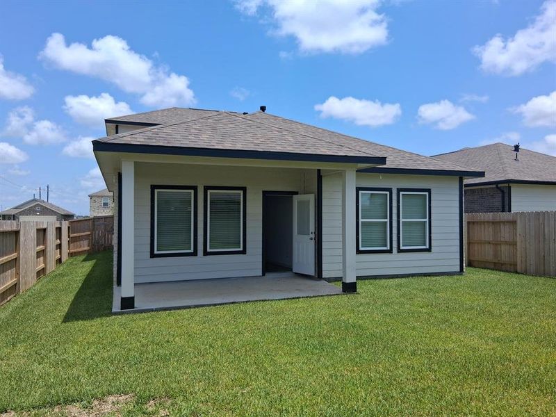 Front exterior of a new home in Windrose Green, Angleton, TX, highlighting curb appeal (Image 24). Front exterior of a new home in Windrose Green, Angleton, TX, highlighting curb appeal (Image 24).