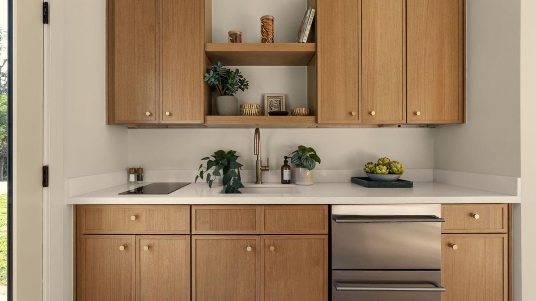 A streamlined kitchen showcasing elegant light wood cabinetry and integrated appliances for a polished look. A streamlined kitchen showcasing elegant light wood cabinetry and integrated appliances for a polished look.