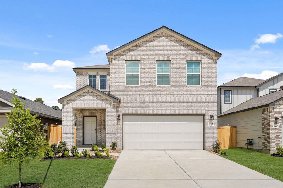 Front exterior of a new home in Maple Woods, Hockley, TX, highlighting curb appeal (Image 2). Front exterior of a new home in Maple Woods, Hockley, TX, highlighting curb appeal (Image 2).
