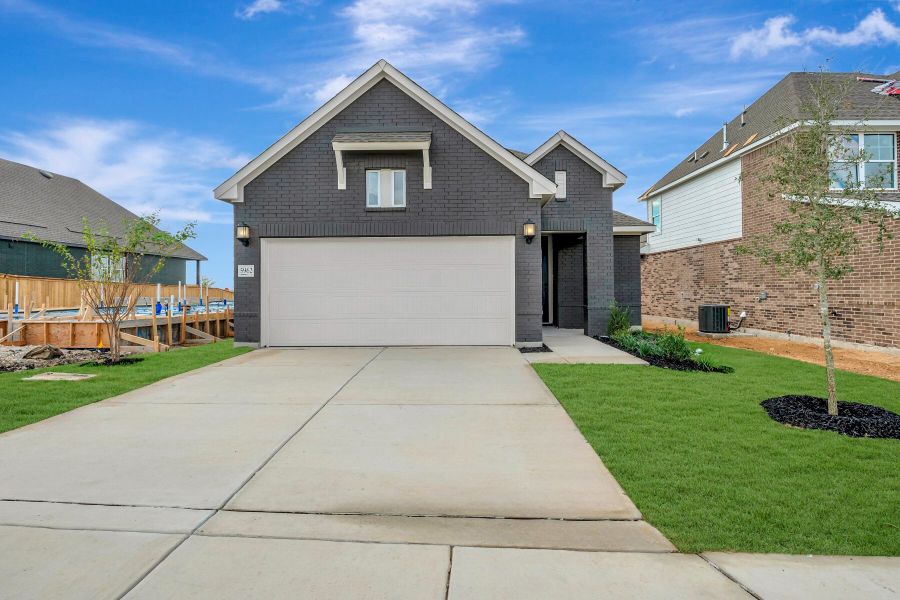 Front exterior of a new home in Mayfair - Select Garden Series, New Braunfels, TX, highlighting curb appeal (Image 1).
