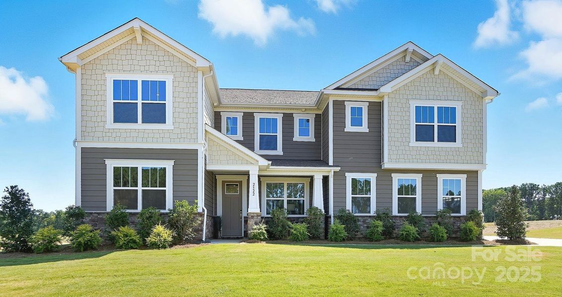 Front exterior of a new home in Blair Place, Monroe, NC, highlighting curb appeal (Image 22).