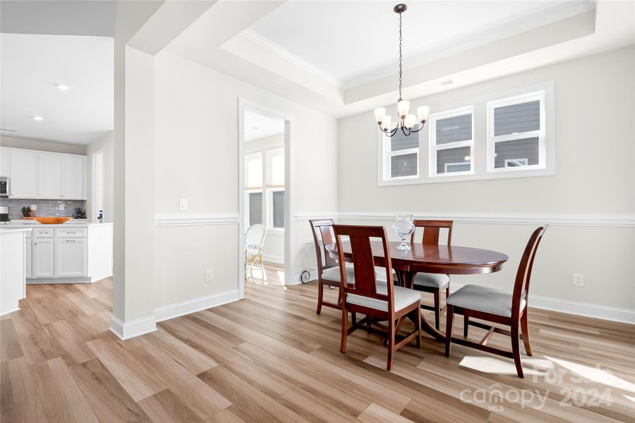 Separate  Dining area with great natural light from transom windows also features low maintenance LVP flooring.