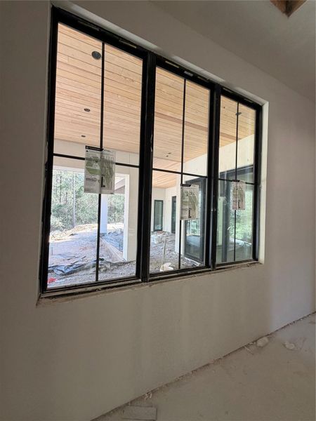 View from windows at hallway outside of Club Room overlooking patio