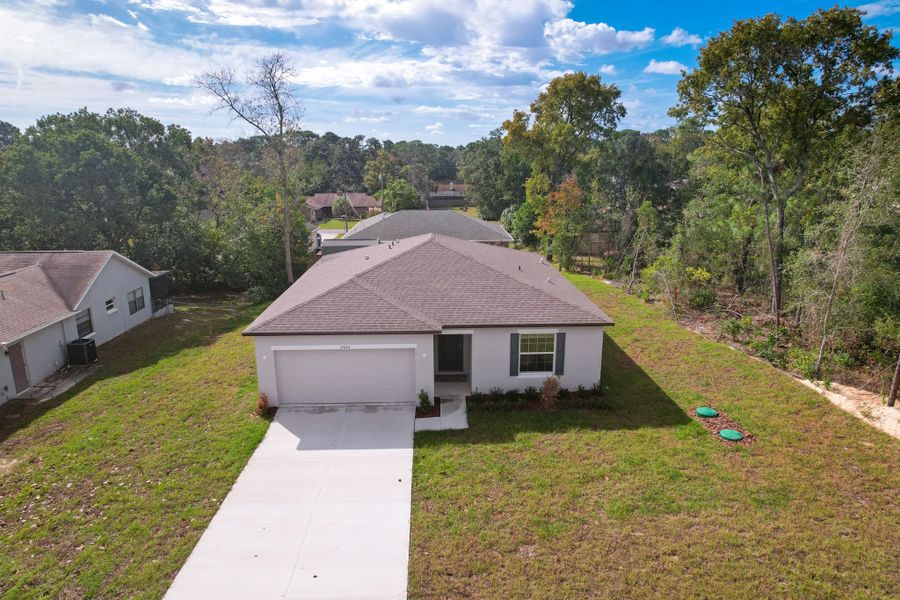 Representative exterior photo of a completed home built from the Oak by Maronda Homes in Coastal Communities, Edgewater, FL (Image 21).