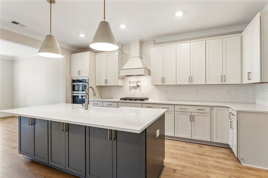 This spacious bathroom offers a double vanity with