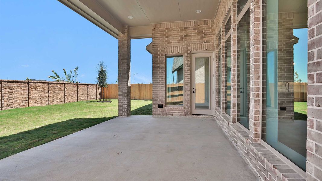 Exterior details and patio area of a home in Lakes of Cane Island, Katy (Image 4).
