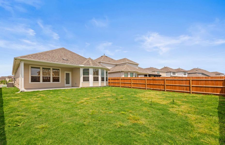 Front exterior of a new home in Santa Rita Ranch, Liberty Hill, TX, highlighting curb appeal (Image 16).