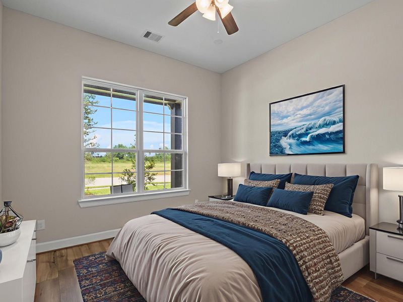 The Promenade III's second bedroom offers a bright and versatile space—perfect for guests, a home office, or a cozy retreat. Image depicts home as-is virtually staged.