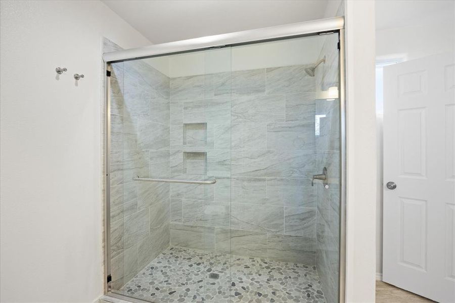 Bathroom with an enclosed shower