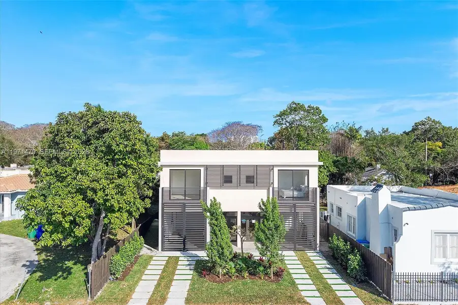 Front exterior of a new home in , Miami, FL, highlighting curb appeal (Image 1). Front exterior of a new home in , Miami, FL, highlighting curb appeal (Image 1).