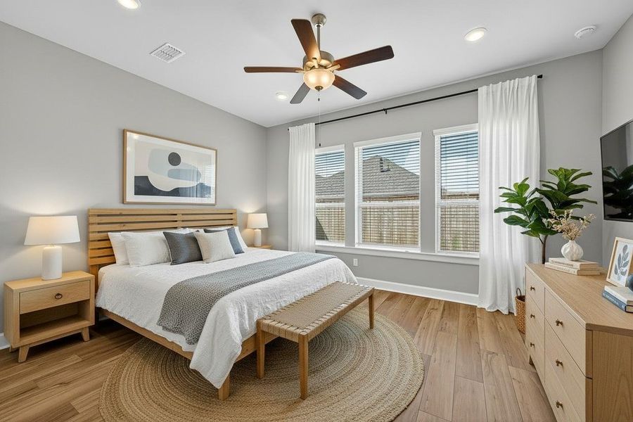 Virtually staged, this inviting primary bedroom features abundant natural light, modern decor, and a cozy ambiance, perfect for relaxation. Virtually staged, this inviting primary bedroom features abundant natural light, modern decor, and a cozy ambiance, perfect for relaxation.
