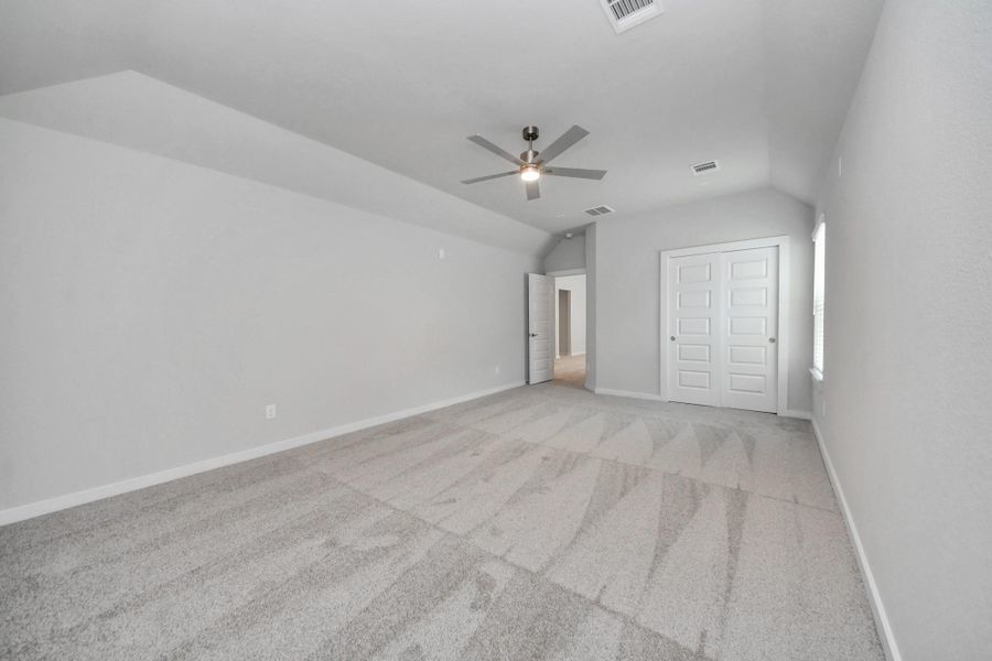 Generously sized secondary bedrooms featuring spacious closets, soft and inviting carpeting underfoot, large windows allowing plenty of natural light, and the added touch of privacy blinds for your personal retreat.