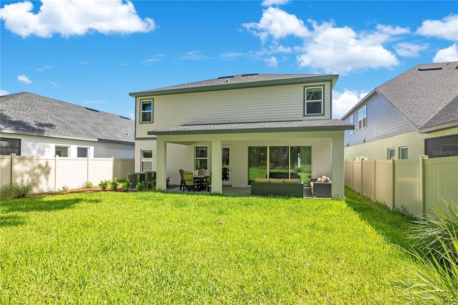 Exterior details and patio area of a home in Oakfield at Mount Dora Village Series, Mount Dora (Image 27).