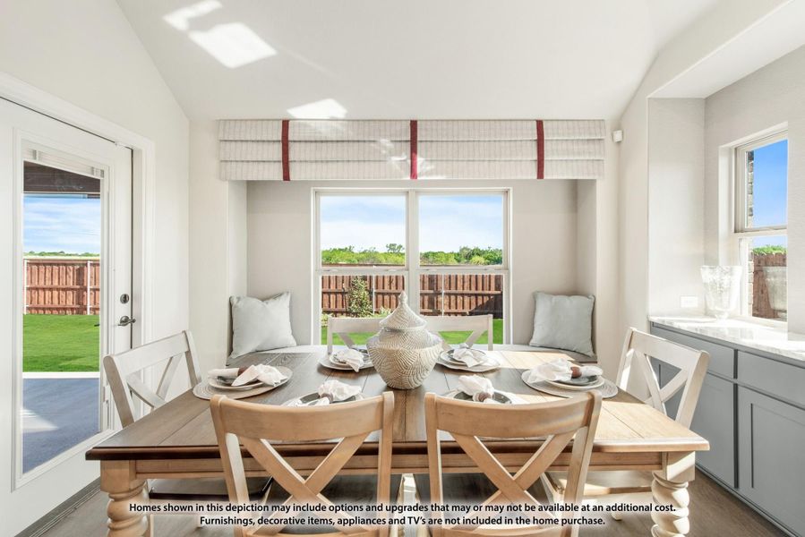 Bright dining area with wooden table, bench seating, large windows, and backyard view through glass door Bright dining area with wooden table, bench seating, large windows, and backyard view through glass door