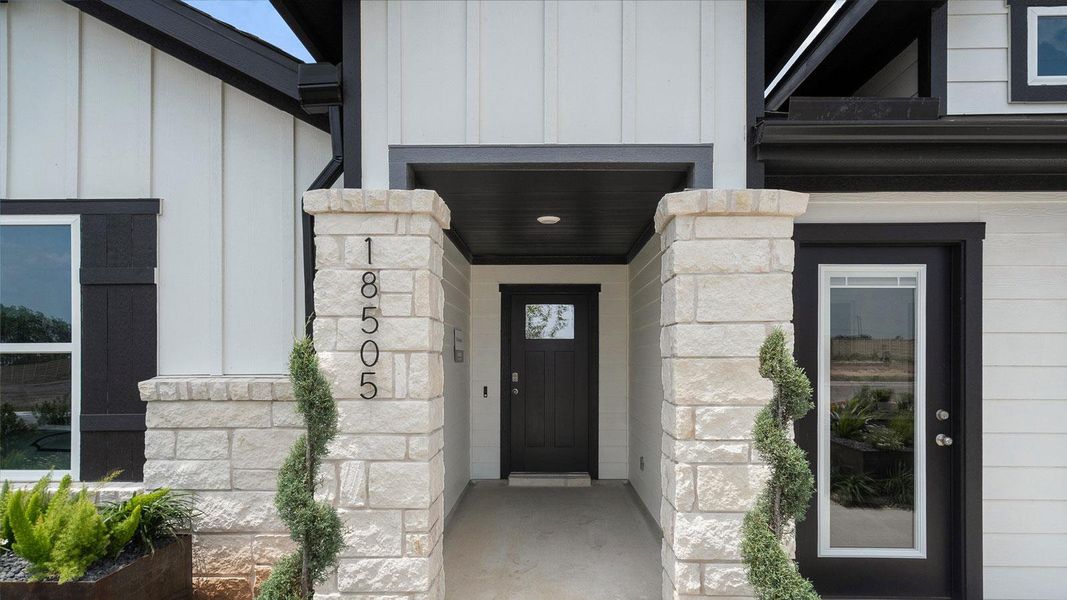 Front exterior of a new home in Monarch Ranch, Manor, TX, highlighting curb appeal (Image 1). Front exterior of a new home in Monarch Ranch, Manor, TX, highlighting curb appeal (Image 1).