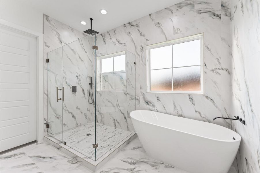 Spa-inspired bath with soaking tub, oversized walk-in shower, and double vanities.Upgraded finishes and thoughtful layout make this a luxurious everyday escape. Spa-inspired bath with soaking tub, oversized walk-in shower, and double vanities.Upgraded finishes and thoughtful layout make this a luxurious everyday escape.