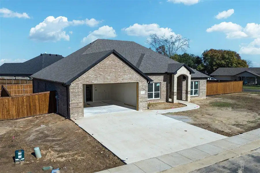 Front exterior of a new home in , Mabank, TX, highlighting curb appeal (Image 2). Front exterior of a new home in , Mabank, TX, highlighting curb appeal (Image 2).