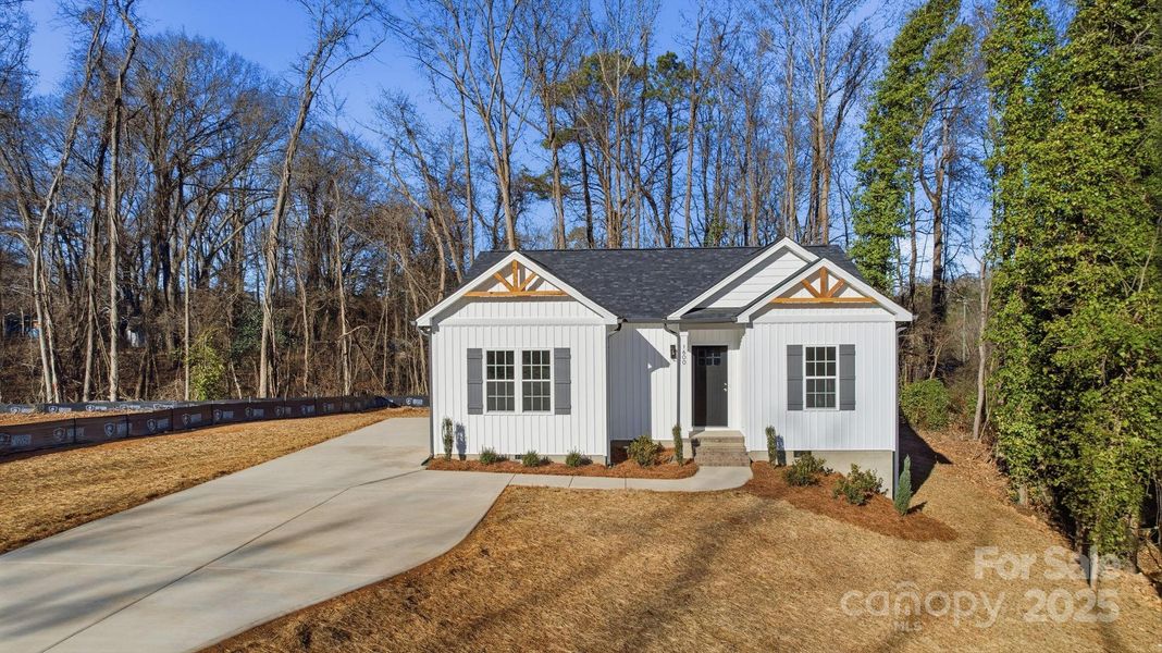 Front exterior of a new home in , Monroe, NC, highlighting curb appeal (Image 18).