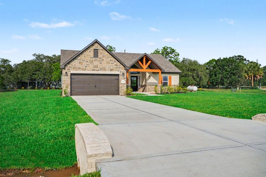 Front exterior of a new home in Little River Ranch, Bay City, TX, highlighting curb appeal (Image 2). Front exterior of a new home in Little River Ranch, Bay City, TX, highlighting curb appeal (Image 2).