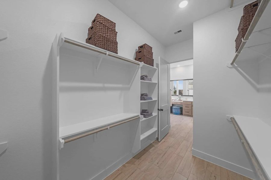 Representative furnished interior of a home built from the Hampton by Chesmar Homes in Meridiana 50's and 60's, Manvel (Image 57).