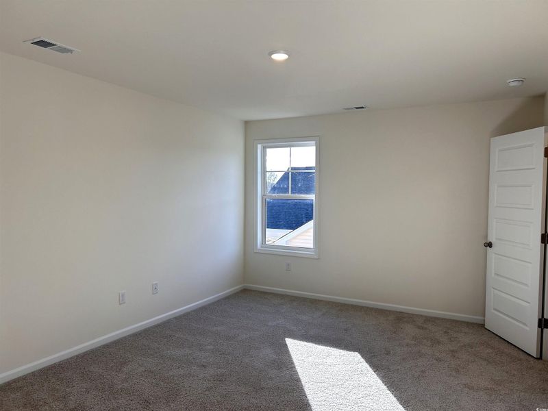 Spare room with carpet flooring and recessed lighting