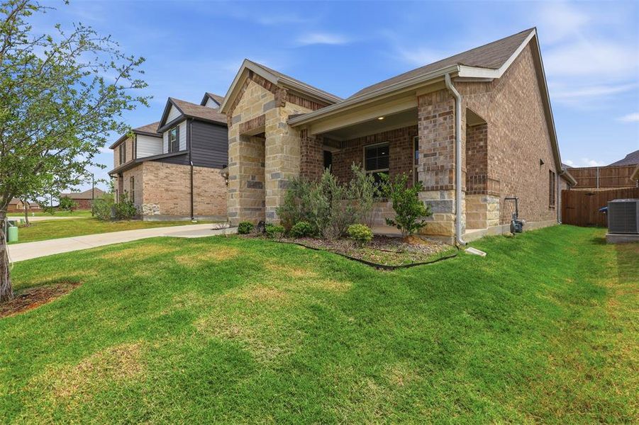 Front exterior of a new home in Tesoro at Chisholm Trail Ranch, Crowley, TX, highlighting curb appeal (Image 1). Front exterior of a new home in Tesoro at Chisholm Trail Ranch, Crowley, TX, highlighting curb appeal (Image 1).